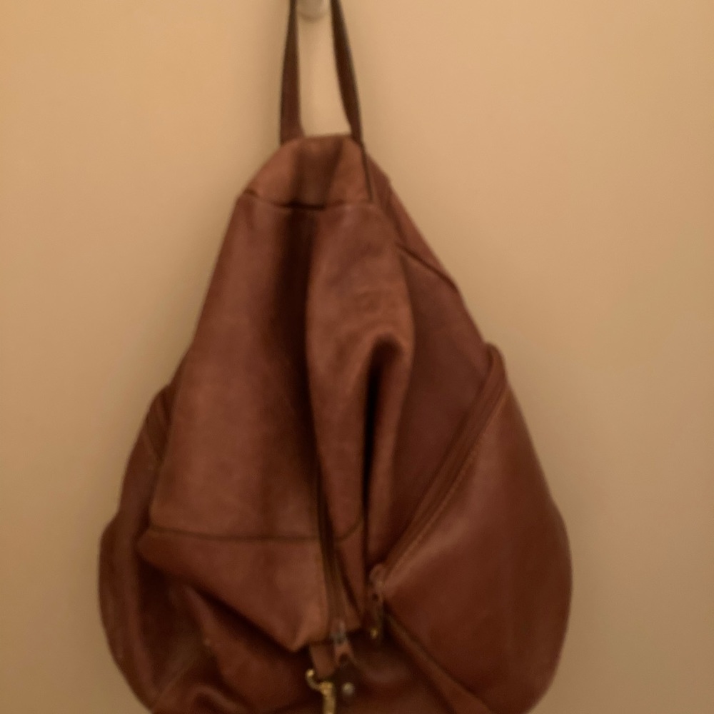 Leather backpack style bag.